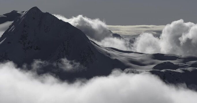 4K timelapse of mountain mist rising and clouds in the Coastal Mountains, Garibaldi Provincial Park, British Columbia, Canada at sunrise