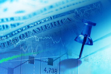 Close up of pin on graph data. Finance concept.