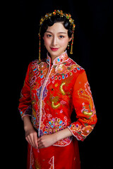 Women in Asian red costume on black background