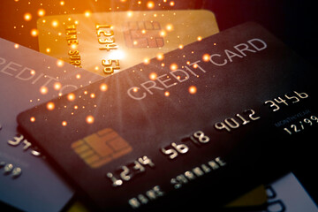 mockup a black credit card above a pile of colorful card background with beautiful glitters