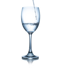 Empty wine glass isolated on white background. Water pouring in glass isolated on white background.  This has clipping path.