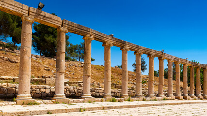 Fototapeta premium It's Colonnade on the Roman Oval Forum, Ancient Roman city of Gerasa, modern Jerash, Jordan
