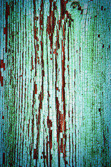 Old painted plank woth design background with peeling paint