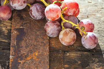 Grape on a wooden barrel. Macro image.