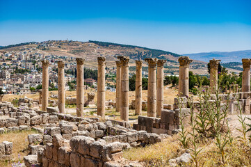 Fototapeta na wymiar It's Columns of the Ancient Roman city of Gerasa of Antiquity , modern Jerash, Jordan