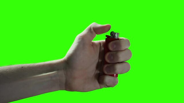 Broken Lighter, Cigarette Lighter Does Not Work on Green Background. Close-Up.  You can replace green screen with the footage or picture you want. You can do it with “Keying” effect in After Effects.