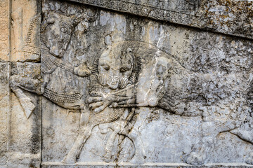 It's Relief of a lion biting antelope.Persepolis, the ceremonial capital of the Achaemenid Empire. UNESCO World Heritage