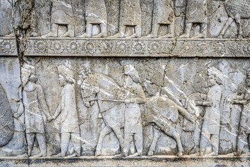 It's Relief of nations bringing tribute, staircase to Apadana. Persepolis, the ceremonial capital of the Achaemenid Empire. UNESCO World Heritage