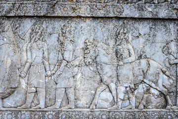 It's Relief of nations bringing tribute, staircase to Apadana. Persepolis, the ceremonial capital of the Achaemenid Empire. UNESCO World Heritage