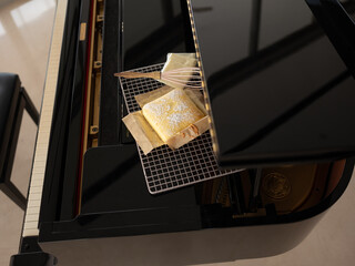 Cheesecake with Patula on top of Piano