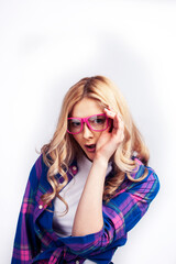 Fototapeta premium young pretty blond teenage hipster girl in glasses posing emotional happy smiling, gesturing isolated on white background, lifestyle poeple concept