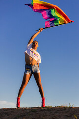 Confident Man celebrating equality and pride during sunset.