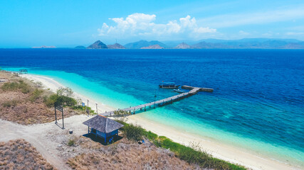 Fototapeta na wymiar Aerial view of a small wooden pier at in Paserang Island, Sumbawa, Indonesia