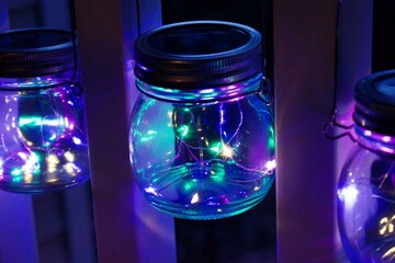 Three hanging Glass Mason Jar with LED lights inside