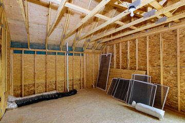 Obraz na płótnie Canvas Beam framework frame house attic under construction interior inside a frame walls and ceiling material