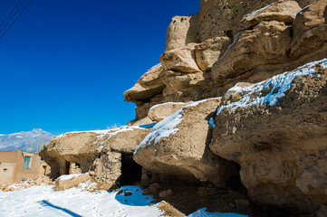 It's Ruins of a fortress in the abandoned village Taganrut in winter (Mountain Lake) in Iran