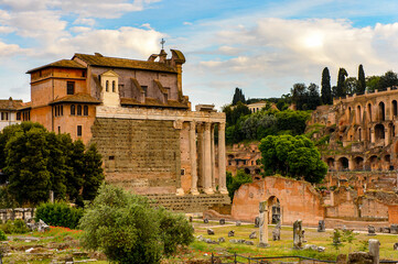 It's Roman Forum in the evening, a rectangular forum surrounded by the ruins of several important...