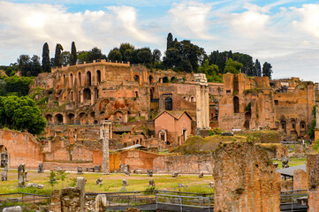 It's Roman Forum in the evening, a rectangular forum surrounded by the ruins of several important...
