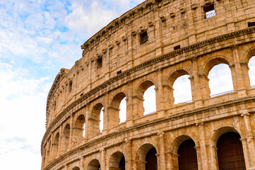 Fototapeta na wymiar It's Colosseum or Coliseum in the evening, Rome, Italy. One of the main touristic destinations in Rome