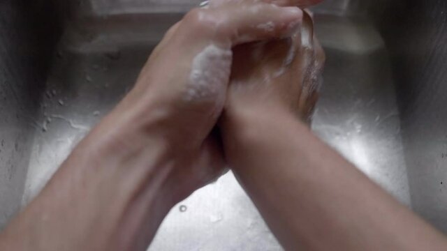 Person Cleaning His Hands With Soap To Prevent Corona Virus  - Close Up Shot