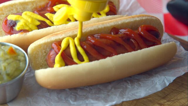 hot dog with french fries on red check table clothes