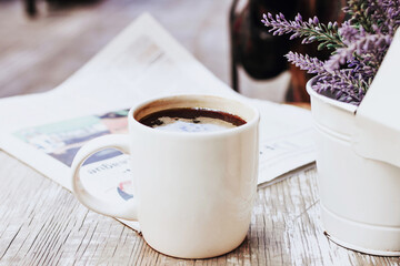 cup of coffee in the street or outdoors at coffee shop or cafe with blurred background