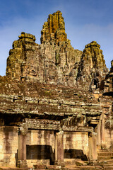 It's Bayon, Khmer temple at Angkor in Cambodia. Official state temple of the Mahayana Buddhist King Jayavarman VII