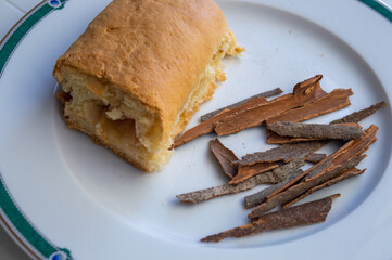 Homemade bread with cinnamon sticks on a plate