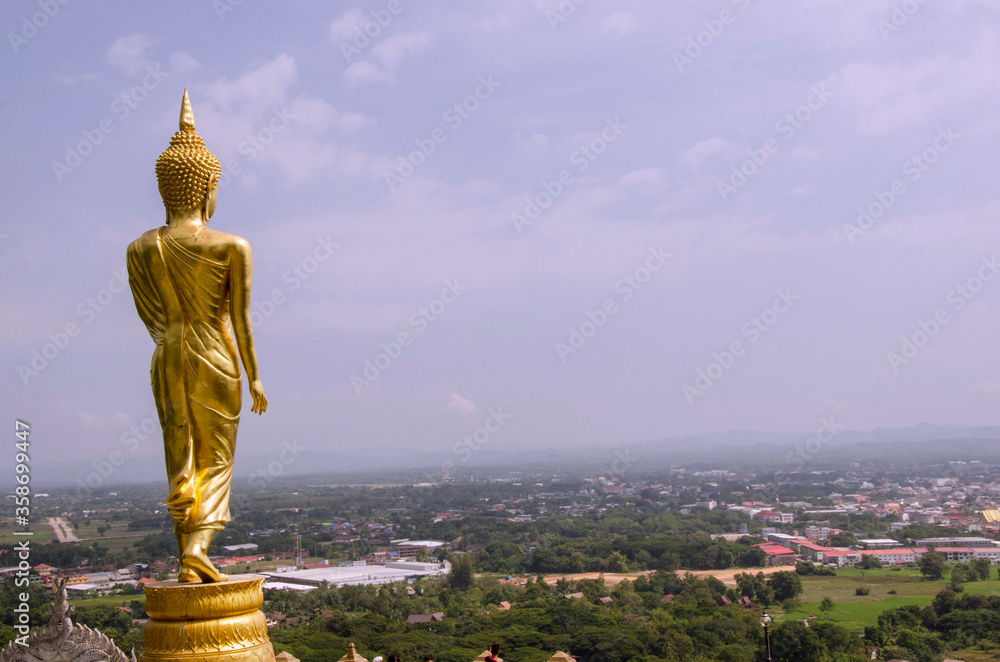 Wall mural Walked buddha image for forest and village protection