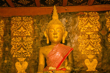 Gold Buddha image with beautiful Thai pattern background