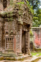 Fototapeta na wymiar It's Part of the Ta Prohm (Rajavihara), a temple at Angkor, Province, Cambodia. It was founded by the Khmer King Jayavarman VII as a Mahayana Buddhist monastery and university.