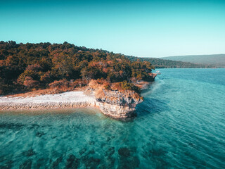 Aerial drone view of an empty beach in tropical Moyo Island, Sumbawa, Indonesia