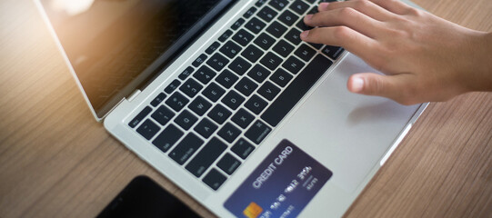 Online shopping, payment at the store, credit card concept, smartphone and laptop, media size banner, focus at the business concept.
