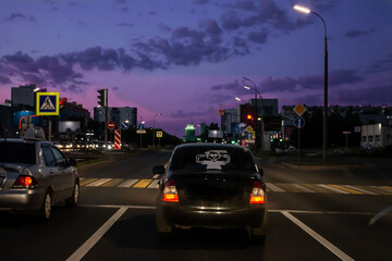 photo city at night, road, cars in the artistic treatment