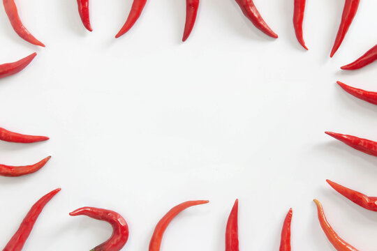 A lot of red hot chili peppers on a white background. a concept hot spice for food. top view, flat lay. Concept red food, .