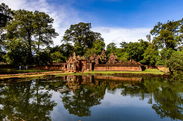 It's Banteay Srei or Banteay Srey , a 10th-century Cambodian temple dedicated to the Hindu god Shiva.