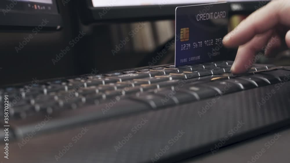 Poster 4k hand key number of credit card on keyboard. video concept for online shopping and ecommerce.
