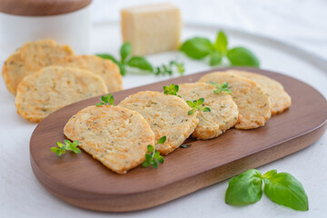 home made cheese crackers with herbs on a table