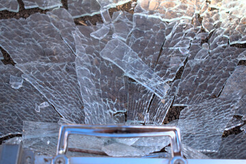 shattered glass close up with metal frame