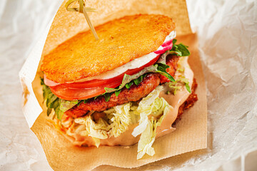 burger with potato pancakes and sauce