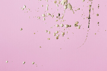 Pink cardboard with gold potal drops and splashes. Creative background, copy space