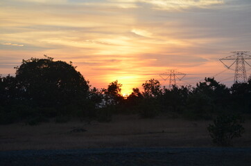 Amazing Sunrise with mountains forests and clouds with Blue orange saffron golden sky