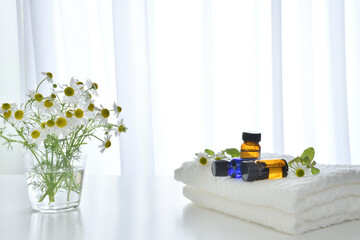 Aroma oil with chamomile flowers
