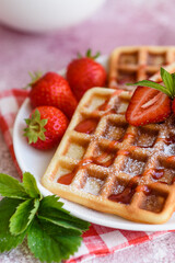 Delicious fresh baked belgian waffles with berries and fruit