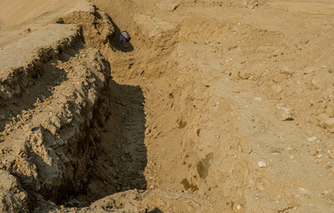 Ditch for under ground sewage pipes at new construction site.