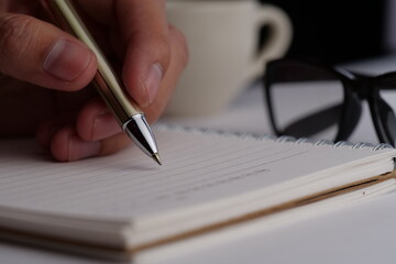 hand writing on a notebook