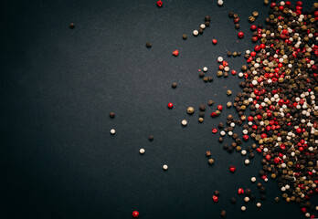 Collection of peppercorn in black background