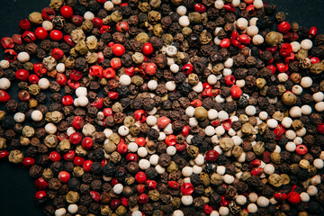 Collection of peppercorn in black background