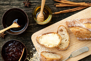 A closeup top view of freshly baked traditional Italian Ciabatta breads prepared and cut in to...