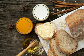 A closeup top view of freshly baked traditional Italian Ciabatta breads prepared and cut in to slices on a wooden table read to be served